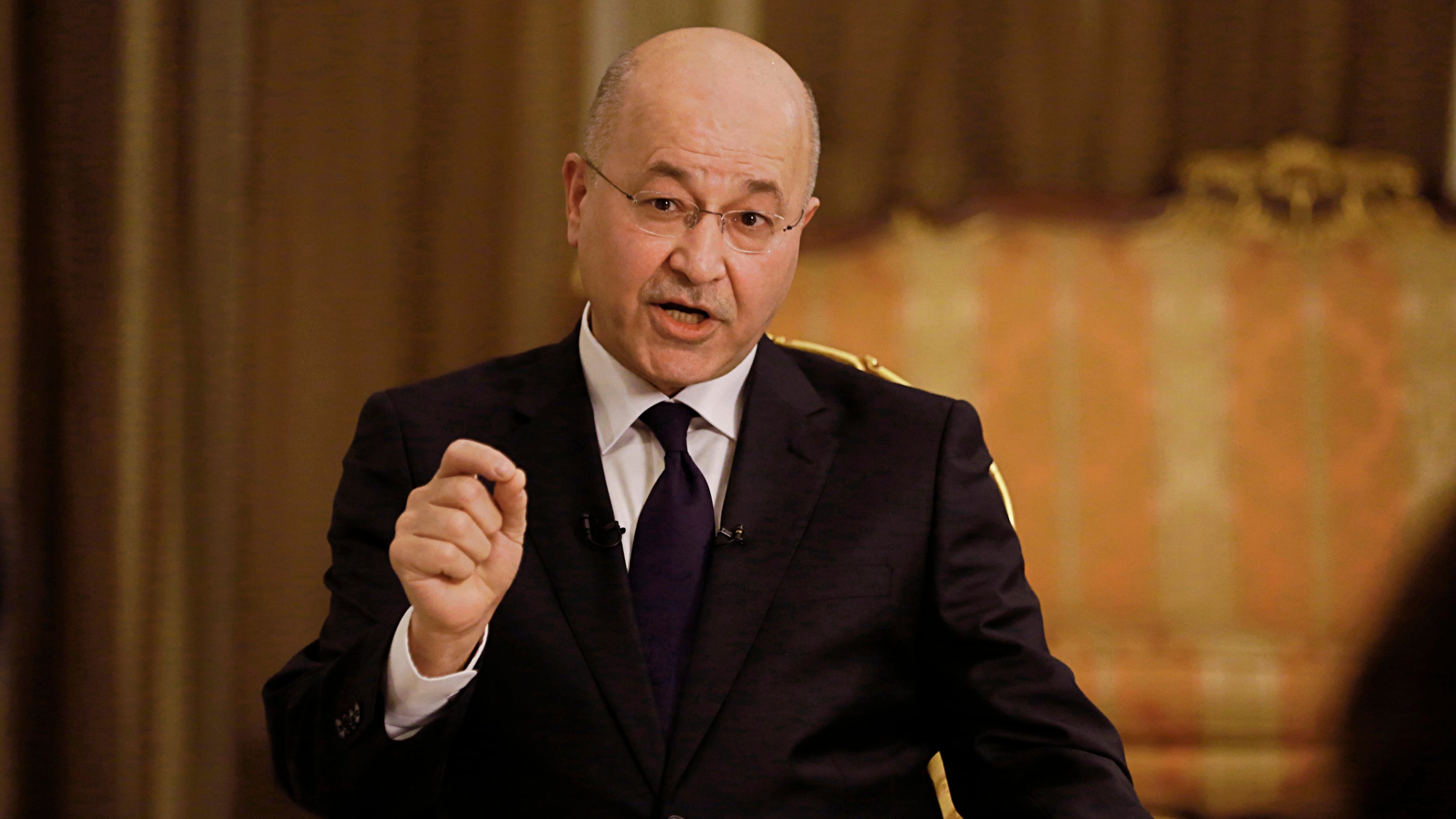 FILE - Iraq's President Barham Salih speaks during an interview with The Associated Press in Baghdad, Iraq, Friday, March 29, 2019. (AP Photo/Khalid Mohammed, File )