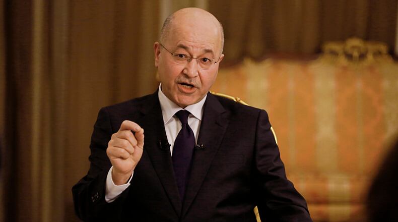 FILE - Iraq's President Barham Salih speaks during an interview with The Associated Press in Baghdad, Iraq, Friday, March 29, 2019. (AP Photo/Khalid Mohammed, File )