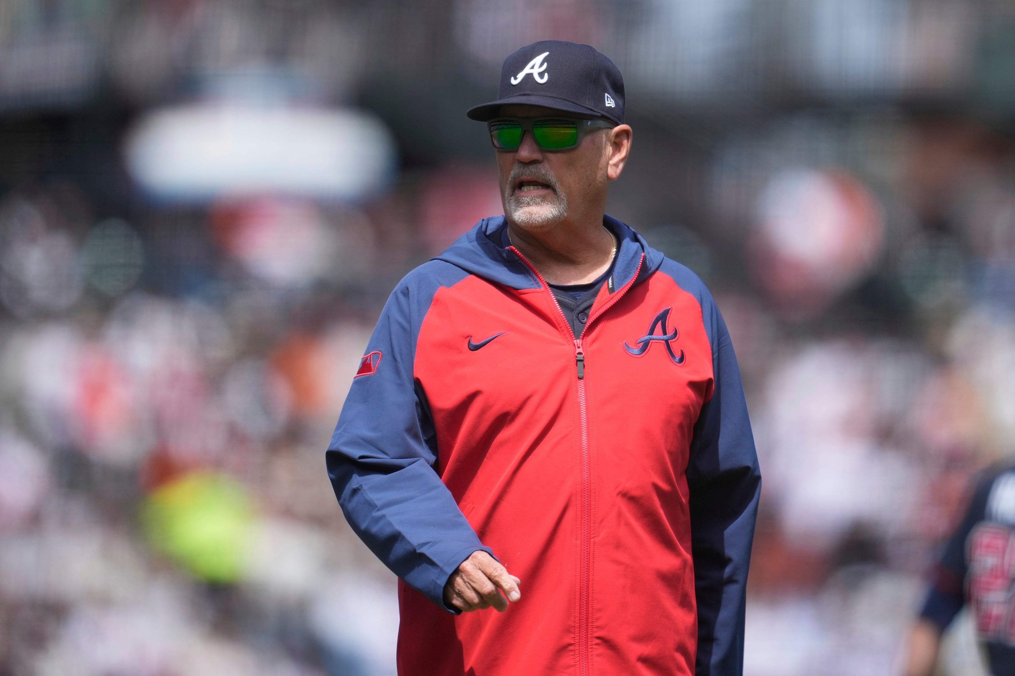 Atlanta Braves manager Brian Snitker walks to the dugout after making a pitching change during the eighth inning of a baseball game against the San Francisco Giants in San Francisco, Sunday, June 8, 2025. (AP Photo/Jeff Chiu)
