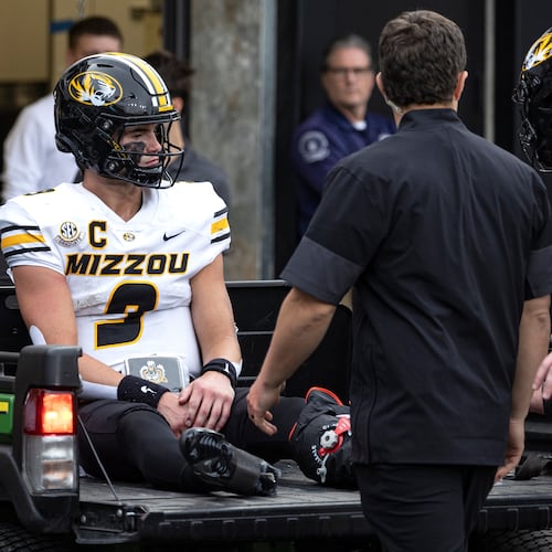Missouri quarterback Beau Pribula is driven off the field after being injured during the second half of an NCAA college football game against Vanderbilt, Saturday, Oct. 25, 2025, in Nashville, Tenn. (AP Photo/Wade Payne)