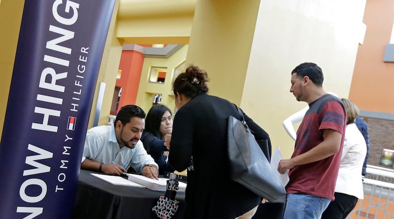FILE - 40,000 jobs added in Metro Atlanta in May. The state has seen unemployment numbers dip as more people gain access to employment. (AP Photo/Alan Diaz, File)
