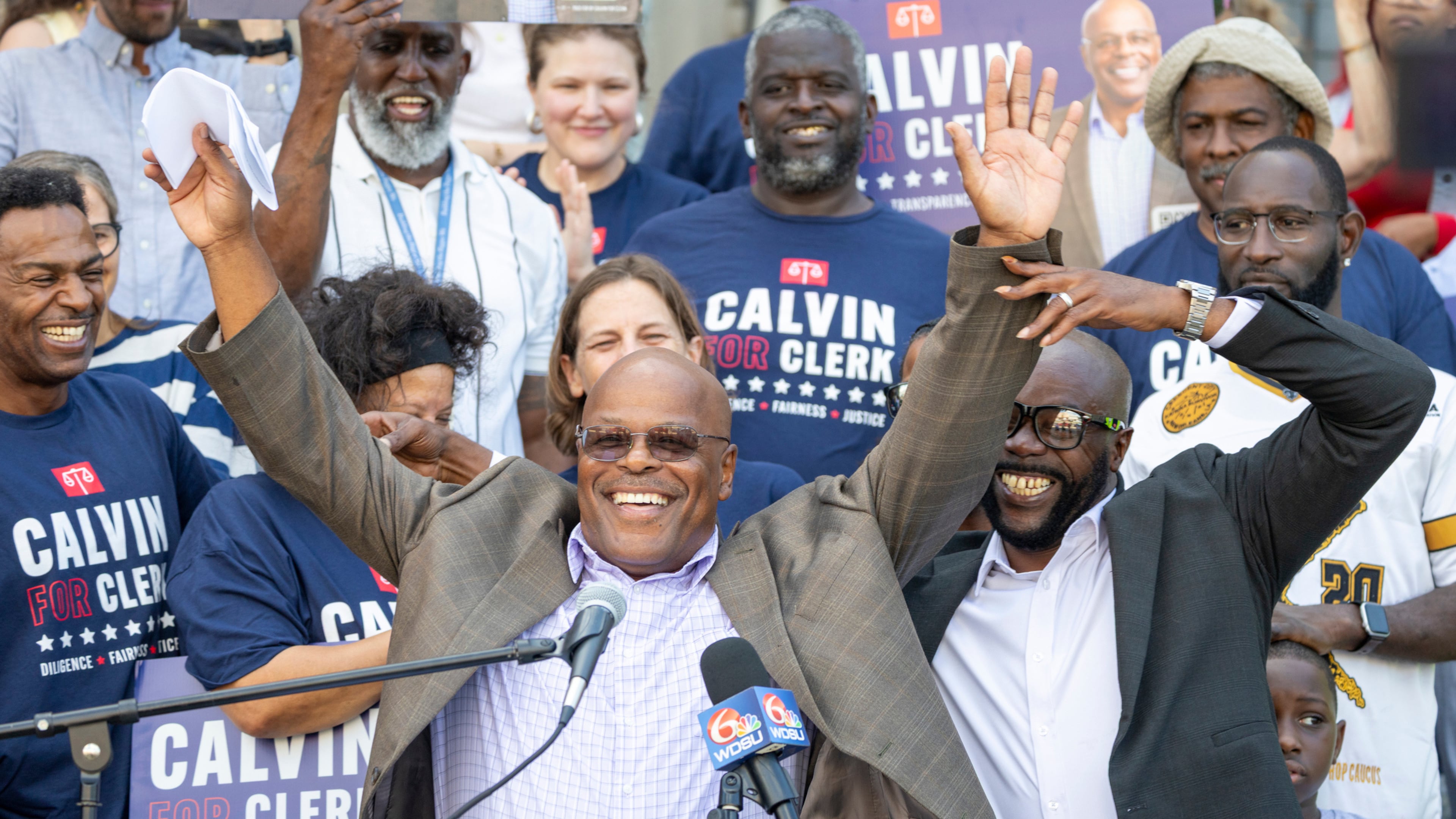 Calvin Duncan, center, stands with supporters on the steps of Orleans Parish Criminal Court to speak about his ambitions to be the next Clerk of Court, Thursday, Oct. 2, 2025. (Chris Granger/The Times-Picayune/The New Orleans Advocate via AP)