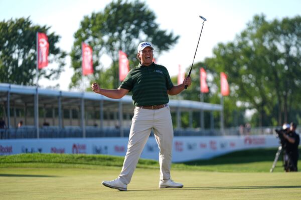Aldrich Potgieter, of South Africa celebrates his winning putt in a playoff during the final round of the Rocket Classic golf tournament at the Detroit Golf Club, Sunday, June 29, 2025, in Detroit. (AP Photo/Paul Sancya)