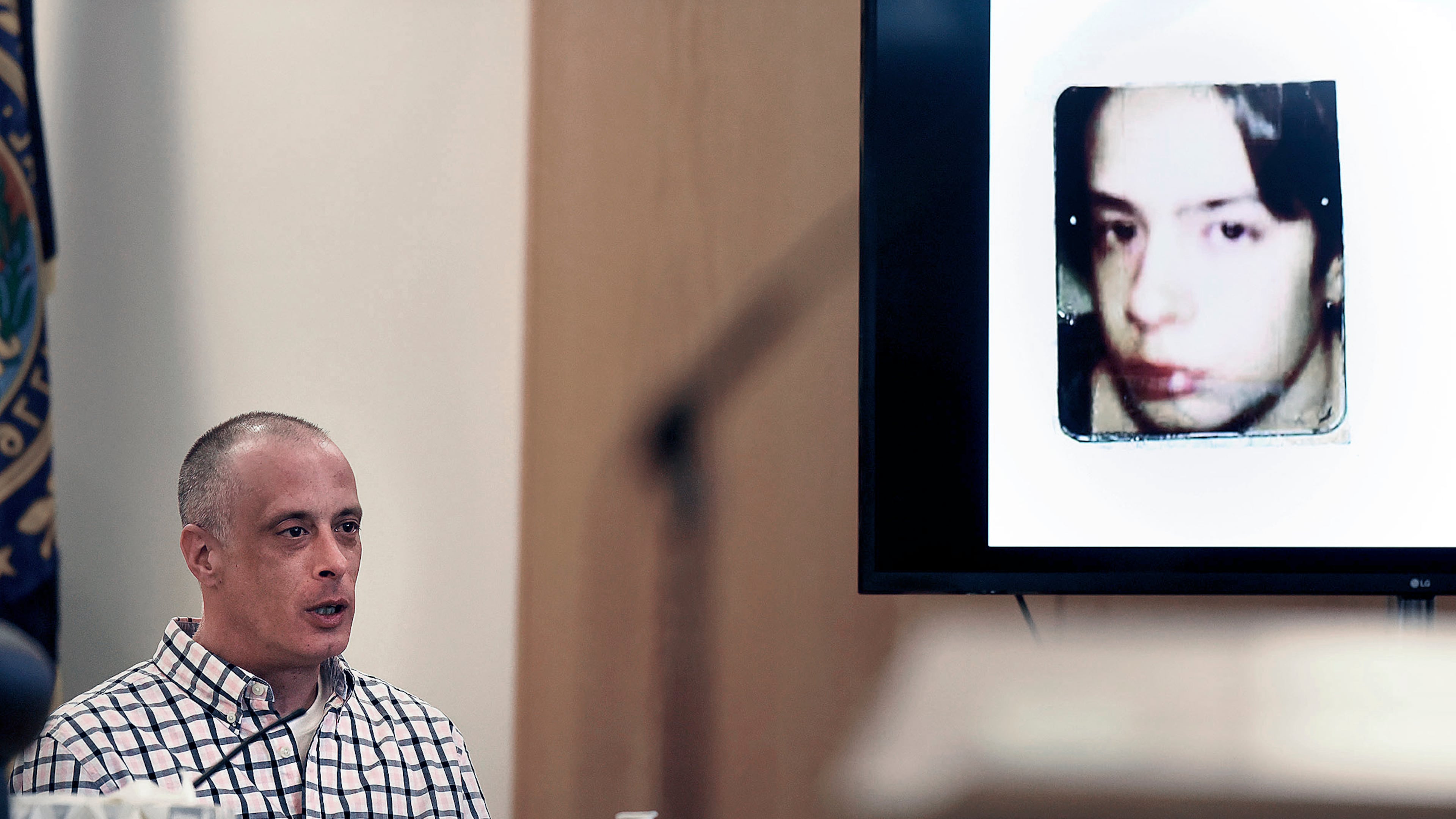 FILE - Youth Development Center. plaintiff David Meehan testifies as his intake photo, when he was 14 is displayed during his civil trial at Rockingham County Superior Court in Brentwood, N.H. on April 17, 2024. (David Lane/Union Leader via AP, Pool, file)