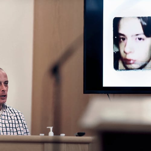 FILE - Youth Development Center. plaintiff David Meehan testifies as his intake photo, when he was 14 is displayed during his civil trial at Rockingham County Superior Court in Brentwood, N.H. on April 17, 2024. (David Lane/Union Leader via AP, Pool, file)