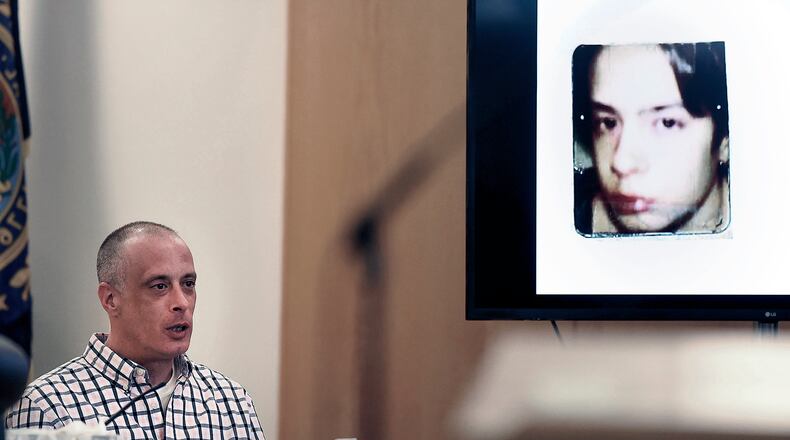 FILE - Youth Development Center. plaintiff David Meehan testifies as his intake photo, when he was 14 is displayed during his civil trial at Rockingham County Superior Court in Brentwood, N.H. on April 17, 2024. (David Lane/Union Leader via AP, Pool, file)