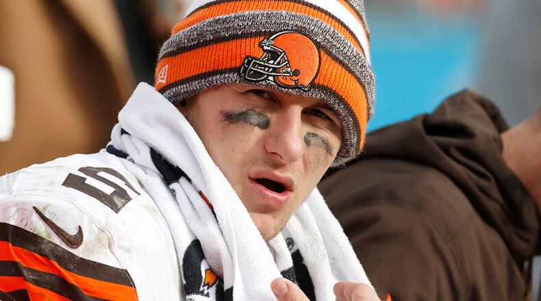 FILE - In this Sunday, Dec. 21, 2014, file photo, Cleveland Browns quarterback Johnny Manziel (2) sits on the bench during the second half of an NFL football game against the Carolina Panthers in Charlotte, N.C. An advisor for Manziel said in a statement released by the team Monday, Feb. 2, 2015, that Manziel has decided to enter treatment for an unspecified condition. (AP Photo/Bob Leverone, File)