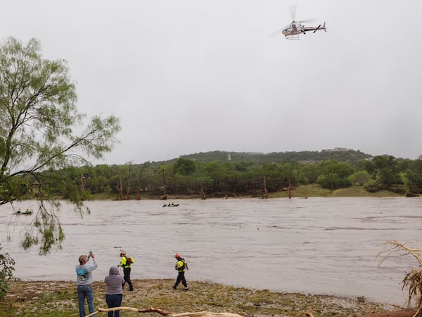 A Texas DPS helicopter conducts arial searches along the Guadalupe River in the wake of a destructive flooding event in Kerrville on Friday July 4, 2025. (Christopher Lee/The San Antonio Express-News via AP)
