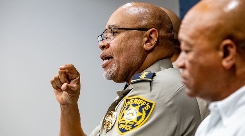 Gwinnett County Sheriff Keybo Taylor, with Cobb County Sheriff Clyde Owens, right, at his side on Tuesday, June 29, 2021. (Jenni Girtman for The Atlanta Journal-Constitution