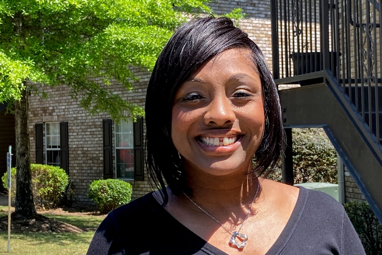 Ashley Jordan, previously known as Ashley Debelbot, poses for a photo for a photo in Columbus, Ga., on April 22, 2021. The 11th season of the AJC's 'Breakdown' podcast covered the case of Ashley Jordan and Albert Debelbot, a then-married couple convicted of murdering their newborn daughter. The two spent 12 years in prison before their convictions were overturned in 2020, but a judge ruled Wednesday that they are eligible for compensation under Georgia's new wrongful conviction compensation law. (Kate Brumback/AP 2021)