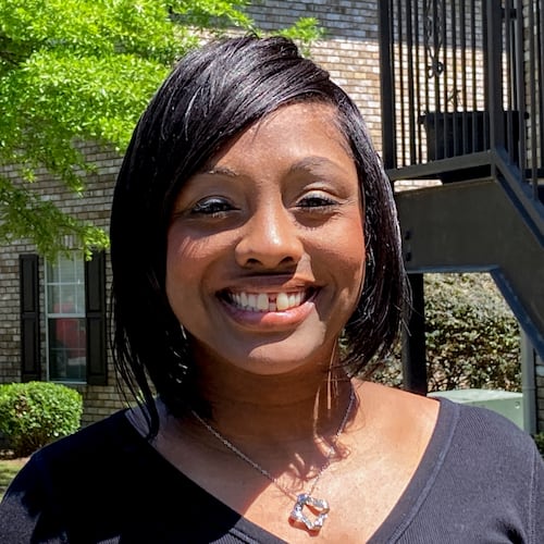 Ashley Jordan, previously known as Ashley Debelbot, poses for a photo for a photo in Columbus, Ga., on April 22, 2021. The 11th season of the AJC's 'Breakdown' podcast covered the case of Ashley Jordan and Albert Debelbot, a then-married couple convicted of murdering their newborn daughter. The two spent 12 years in prison before their convictions were overturned in 2020, but a judge ruled Wednesday that they are eligible for compensation under Georgia's new wrongful conviction compensation law. (Kate Brumback/AP 2021)