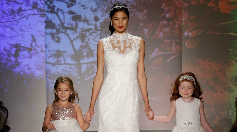 NEW YORK, NY - OCTOBER 05: Models walk the runway at the Alfred Angelo Spring 2017 Bridal Show with Disney Weddings at EZ Studios on October 5, 2016 in New York City. (Photo by JP Yim/Getty Images for Alfred Angelo)