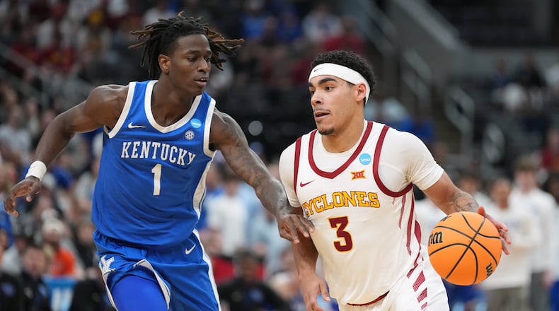 Iowa State's Tamin Lipsey (3) drives past Kentucky's Denzel Aberdeen (1) during the second half in the second round of the NCAA college basketball tournament, Sunday, March 22, 2026, in St. Louis. (AP Photo/Jeff Roberson)