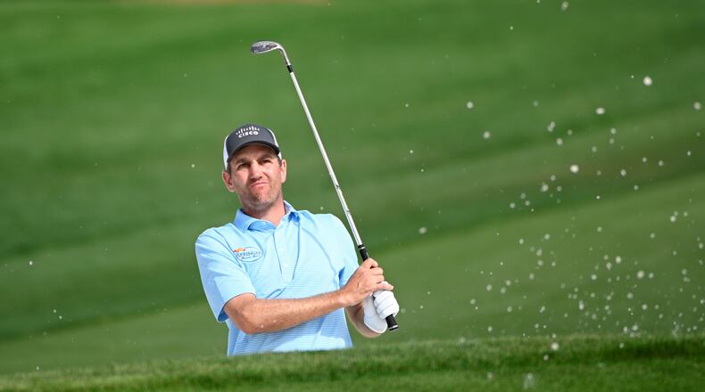 Brendon Todd watches his shot after hitting from a bunker onto the ninth green during the first round of the Arnold Palmer Invitational golf tournament, Thursday, March 5, 2020, in Orlando, Fla. (AP Photo/Phelan M. Ebenhack)