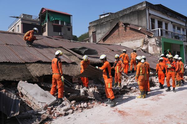 Rescuers work through rubble of a collapsed building following Friday's earthquake in Naypyitaw, Myanmar, Tuesday, April 1, 2025. (AP Photo)