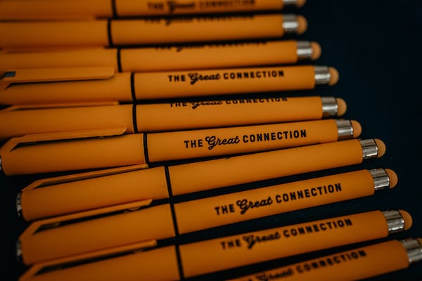 Pens labeled “The Great Connection,” referring to the proposed merger between Union Pacific and Norfolk Southern, at Railway Age’s Next Generation Freight Rail conference at the Union League Club of Chicago on March 10, 2026, in Chicago. (Jamie Kelter Davis for the AJC)