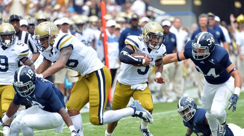 Georgia Tech Yellow Jackets quarterback Justin Thomas (5) rushes against the Georgia Southern Eagles in the first half at Bobby Dodd Stadium on September, 13, 2014. HYOSUB SHIN / HSHIN@AJC.COM