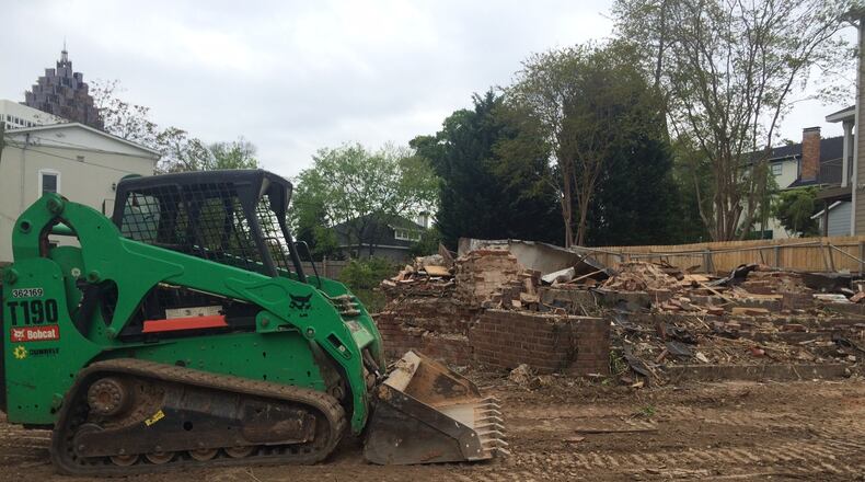 All that was left of the Craigie House Friday was a pile of bricks. Mark C. McDonald, CEO and president of the Georgia Trust for Historic Preeservation, said there was a time capsule in the cornerstone that is still un-accounted for. The former owners, the Daughters of the American Revolution, would like to acquire it, he said. Photo: Bo Emerson