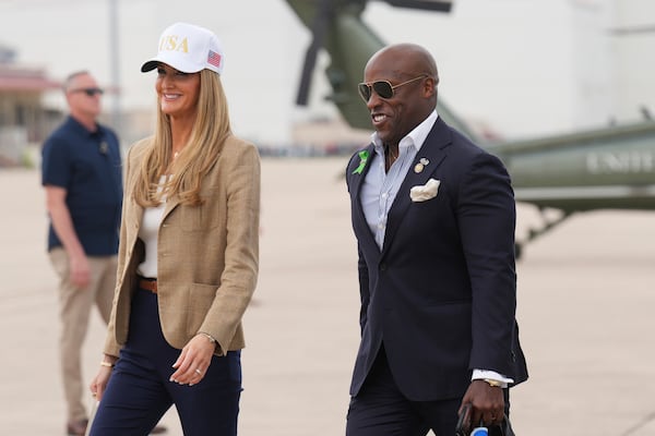 Small Business Administration Chief Kelly Loeffler, left, and Rep. Wesley Hunt, R-Texas, arrive at Kelly Field air base in San Antonio, Texas, en route to observe flood damage in Kerrville, Texas, Friday, July 11, 2025. (AP Photo/Jacquelyn Martin)