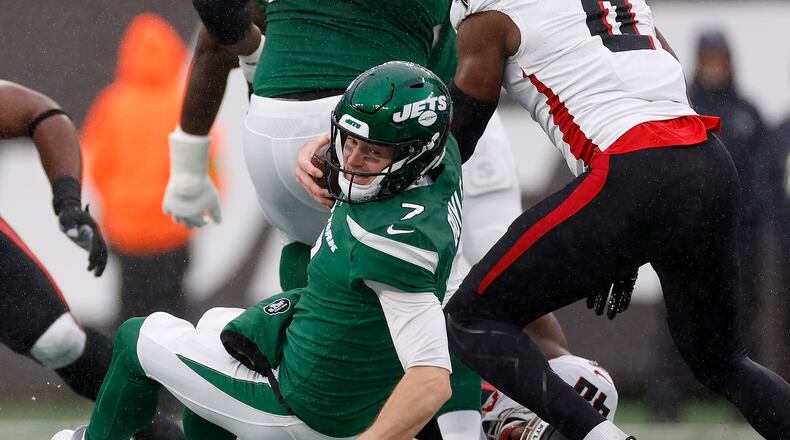 Tim Boyle (7) of the New York Jets is tackled by Keith Smith (40) of the Atlanta Falcons during the first quarter at MetLife Stadium on Dec. 3, 2023, in East Rutherford, New Jersey. (Sarah Stier/Getty Images/TNS)