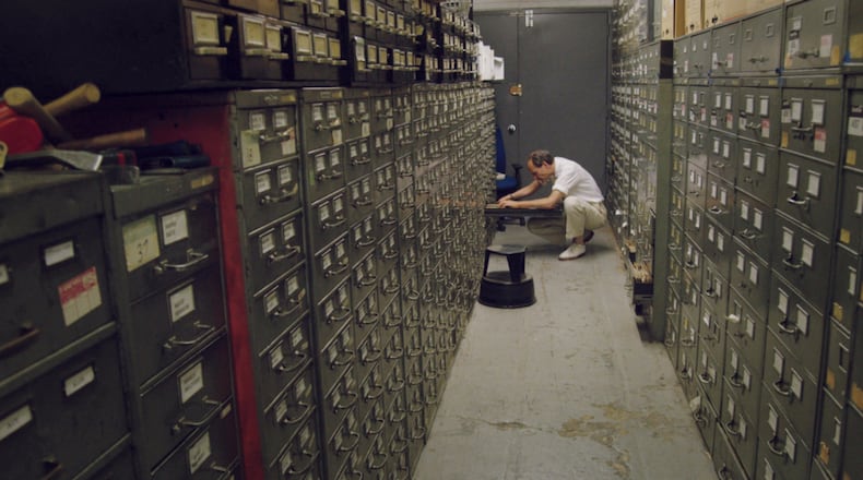 Last remaining archivist Jeff Roth searches The New York Times morgue. Contributed by Kino Lorber