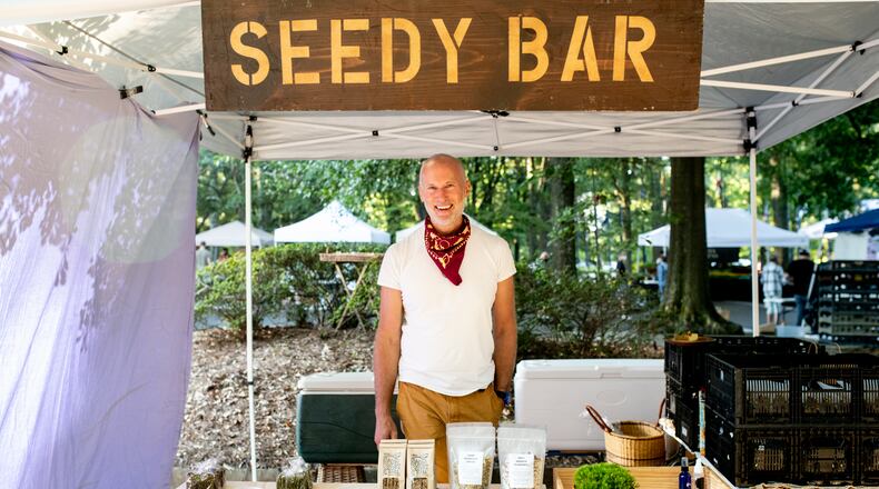 Chef David Sweeney operates his Seedy Bar stall at Freedom Farmers Market. Mia Yakel/For The AJC