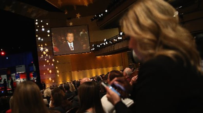 Fox moderator Neil Cavuto speaks at the start of the Republican Presidential Debate in Milwaukee.