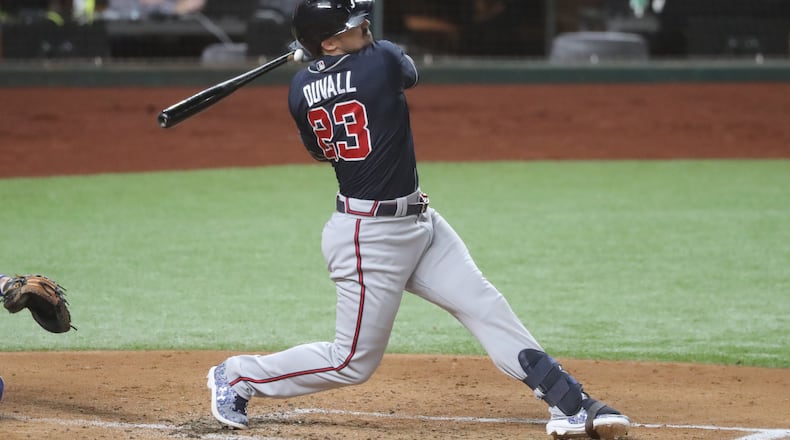 Atlanta Braves left fielder Adam Duvall gets injured on this swing against the Los Angeles Dodgers during the second inning in Game 1 Monday, Oct. 12, 2020, for the best-of-seven National League Championship Series at Globe Life Field in Arlington, Texas. Duvall had to leave the game. (Curtis Compton/Atlanta Journal-Constitution/TNS)