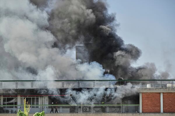 Firefighters work in a building of the Soroka hospital complex after it was hit by a missile fired from Iran in Be'er Sheva, Israel, Thursday, June 19, 2025. (AP Photo/Leo Correa)