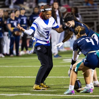 McEachern wide receiver Ava Couzens (left) plays in a flag football game against Marietta on Monday, Nov. 17, 2025, at Osborne High School. Couzens plays wide receiver, quarterback and safety for her flag football team. (Oscar Guevara Saenz for the AJC)