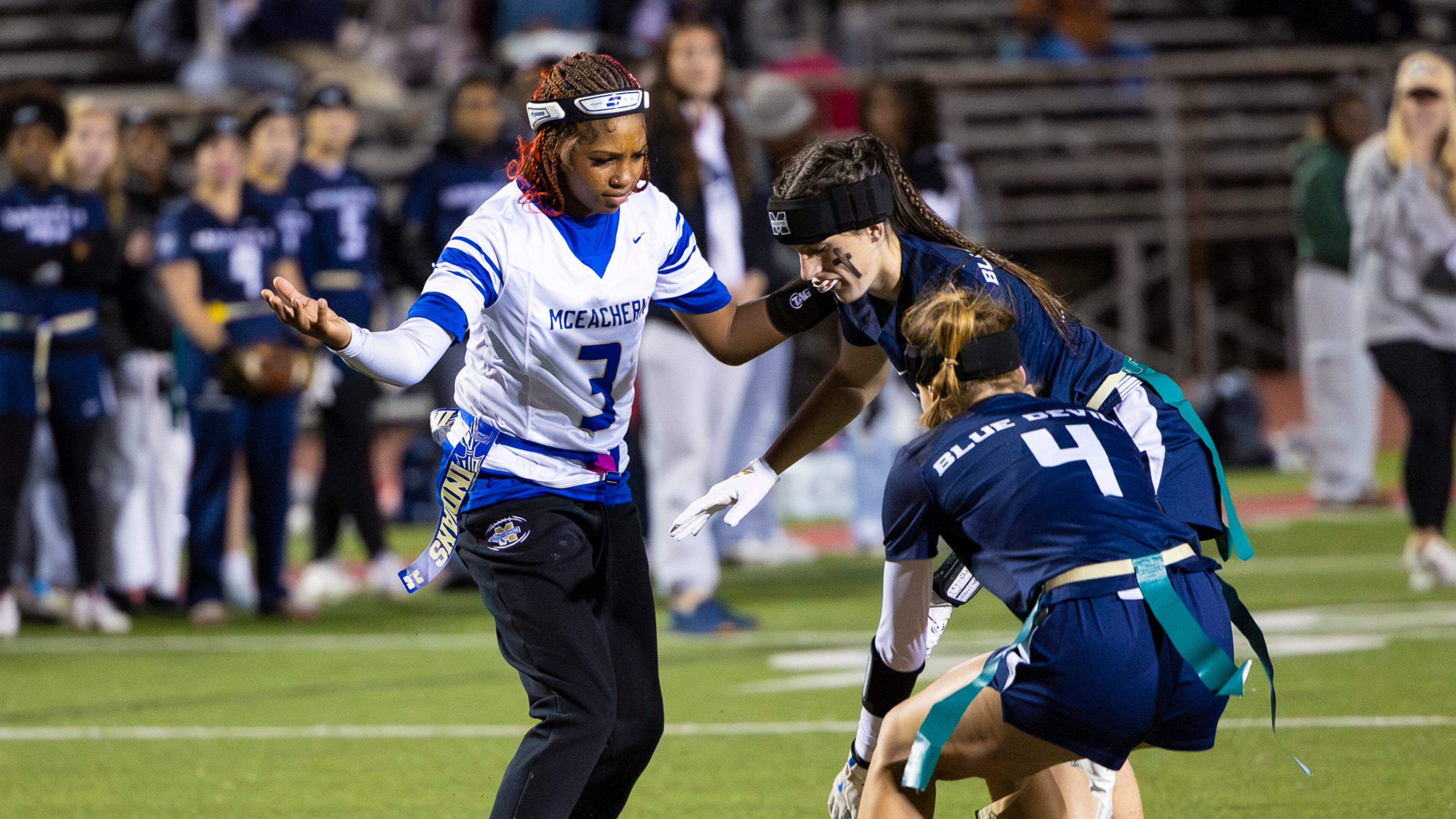 McEachern wide receiver Ava Couzens (left) plays in a flag football game against Marietta on Monday, Nov. 17, 2025, at Osborne High School. Couzens plays wide receiver, quarterback and safety for her flag football team. (Oscar Guevara Saenz for the AJC)