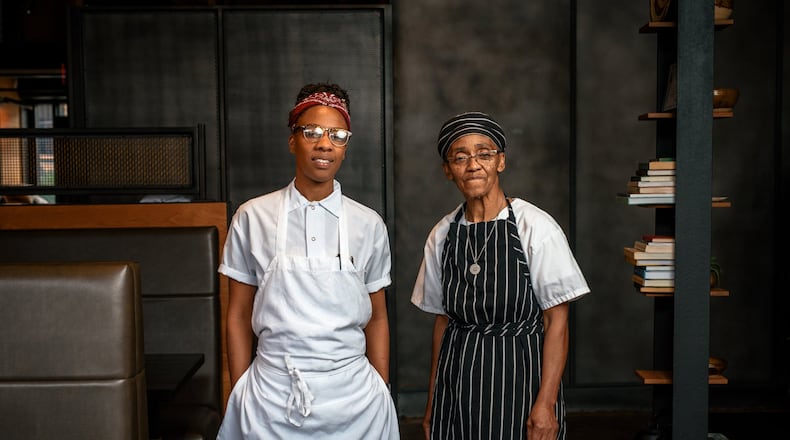 Ashleigh Shanti (left), with Hanan Shabazz, at Benne on Eagle in downtown Asheville, N.C. In the 1970s, Shabazz ran a restaurant on The Block, the African American community that once stood in the surrounding area; she now contributes to the menu. MIKE BELLEME / THE NEW YORK TIMES
