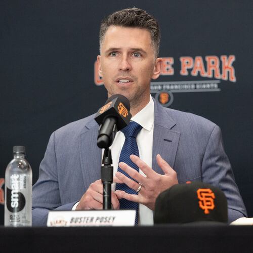 FILE -San Francisco Giants President of Baseball Operations Buster Posey sits during a press conference introducing Tony Vitello as the new manager of the San Francisco Giants baseball team on Oct. 30, 2025, in San Francisco. (AP Photo/Benjamin Fanjoy, File)