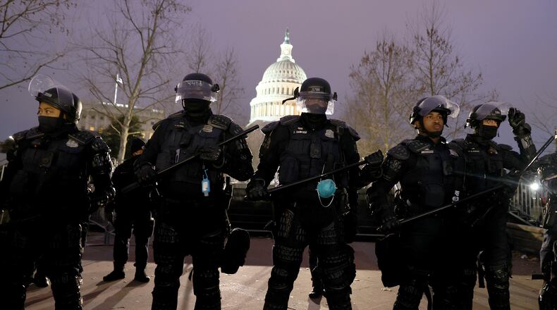 Police officers in riot gear line up as protesters gather at the U.S. Capitol Building on Wednesday, Jan. 6, 2021, in Washington, D.C. (Tasos Katopodis/Getty Images/TNS)
