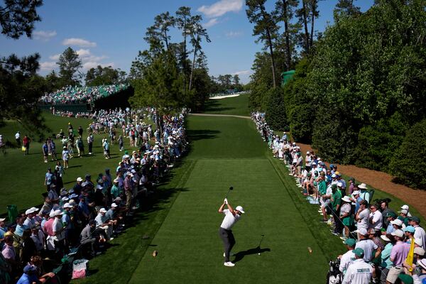 Scottie Scheffler hits his tee shot on the 18th hole during the first round at the Masters golf tournament, Thursday, April 10, 2025, in Augusta, Ga. (AP Photo/David J. Phillip)