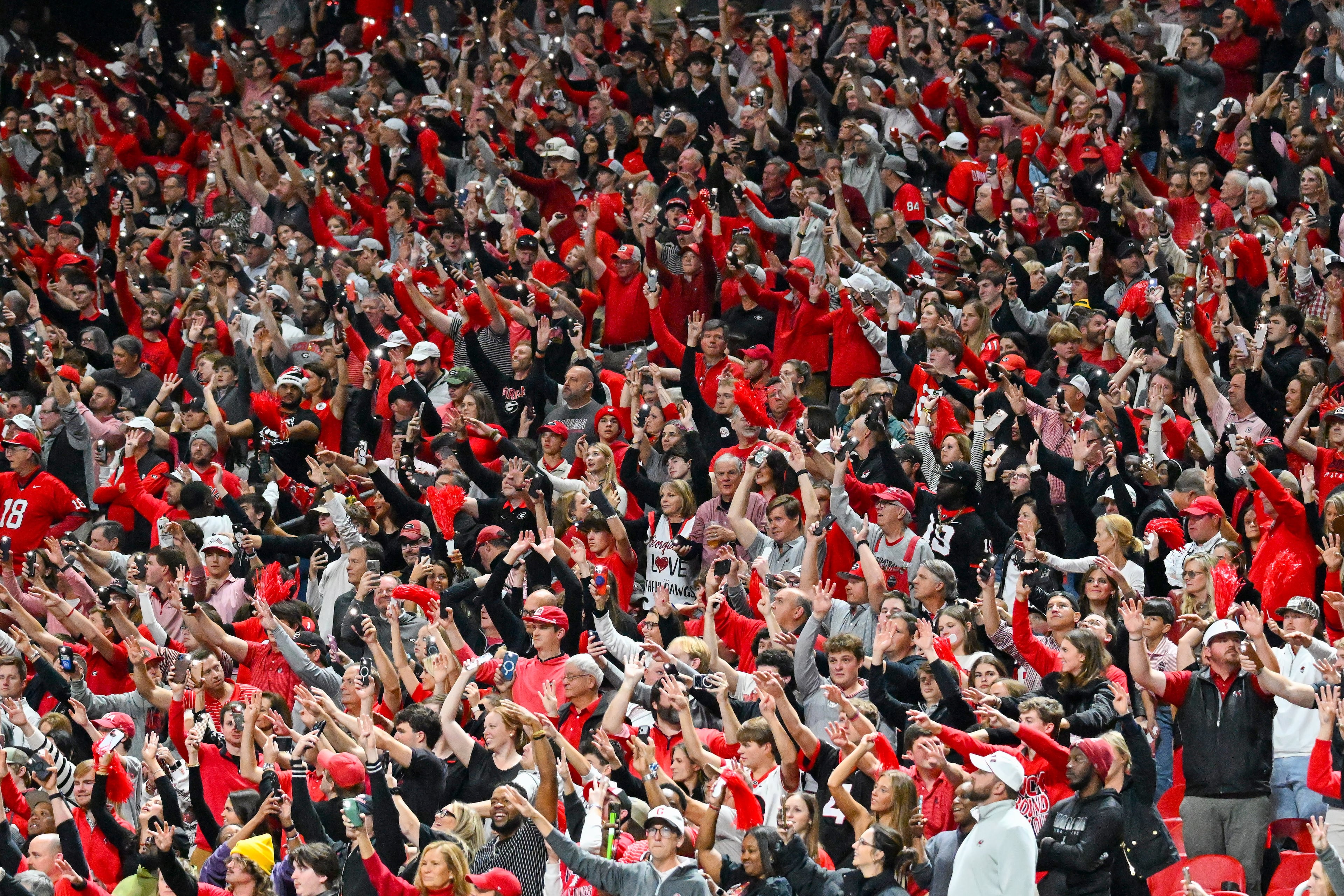 Georgia fans react against Alabama during the fourth quarter of the SEC Championship game at Mercedes-Benz Stadium, Saturday, Dec. 6, 2025, in Atlanta. (Hyosub Shin / AJC)