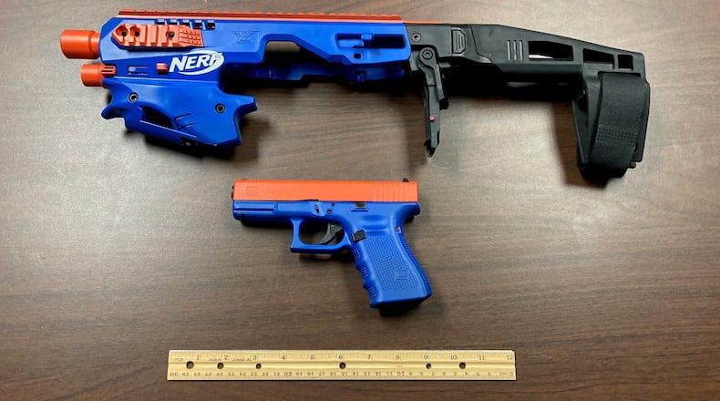 A drug raid in North Carolina turned up narcotics, cash and plenty of guns, including a Glock 19 semiautomatic pistol disguised as a toy Nerf gun. (Image: Catawba County NC Sheriff's Office)