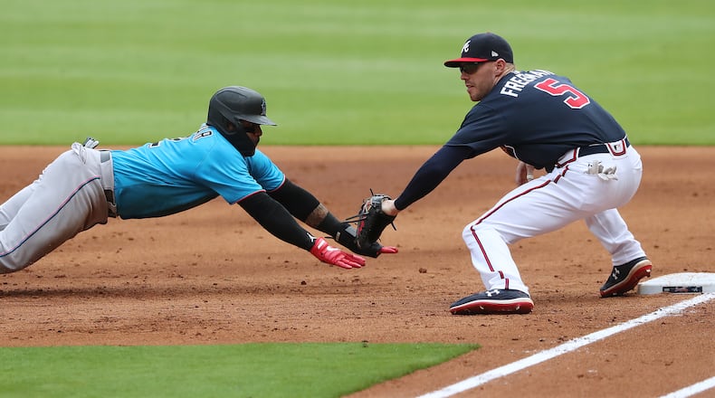 072220 Atlanta: Atlanta Braves Freddie Freeman picks off Miami Marlins Jonathan Villar at first base on a throw from pitcher Kyle Wright during the third inning in an exhibition game on Wednesday, July 22, 2020 in Atlanta.   Curtis Compton ccompton@ajc.com