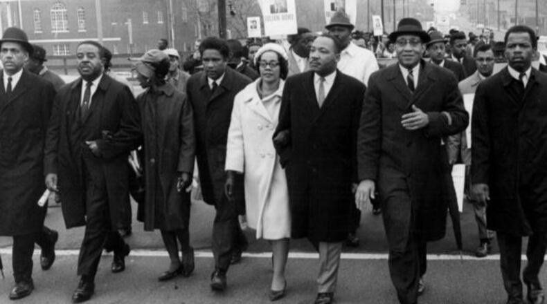 Rev. Martin Luther King Jr., Coretta Scott King, Ralph David Abernathy, John Lewis and others march from Atlanta University to the Georgia State Capitol in 1966. (Photo: The Atlanta Journal-Constitution file photo)
