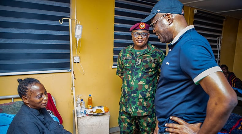 In this photo released by Oyo state government House, Governor Seyi Makinde, right, visits a teacher abducted in May by Islamic militants, following her release at a hospital in southwestern Oyo, Nigeria, Saturday, July 11, 2026. (Oyo State government House via AP)