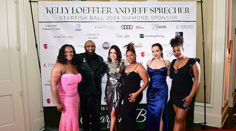 Nsoro chairman and founder Darrell Mays (second left), Tara Mays, an Nsoro board member, Nsoro alumnae Tracy Adirika, Katrina Oglesby, and Julia Garcia, and Nsoro volunteer Linda Oglesby pose at the Starfish Ball 2024 event.
(Courtesy of nsoro Foundation / Photo by Kim Evans)