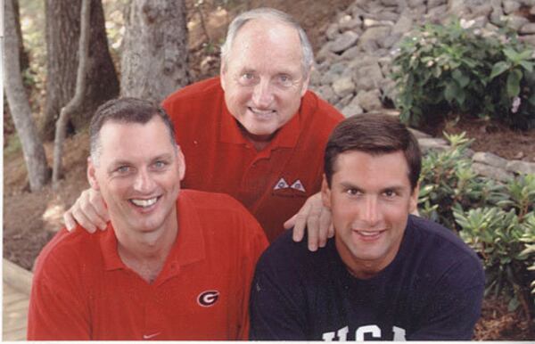 Derek Dooley (right, with older brother Daniel, left, and dad Vince in 2003) played college football at Virginia and high school football at Clarke Central. (Special to AJC)