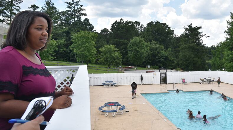 TC Brown, regional manager with Yes! Communities, shows off the swimming pool at Smoke Creek, a manufactured home community south of Snellville. Yes files for eviction far more than at nearly twice the average rate for metro Atlanta. HYOSUB SHIN / HSHIN@AJC.COM
