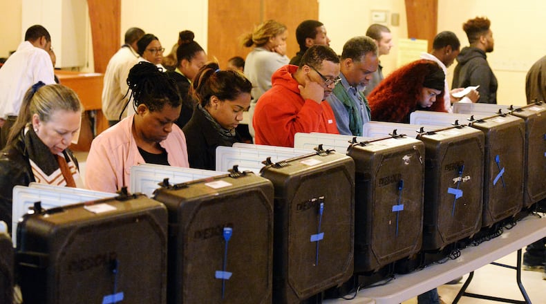 DeKalb County voters go to the polls on Election Day at the Crossroads Presbyterian Church in Stone Mountain on Tuesday morning. Kent D. Johnson, kdjohnson@ajc.com