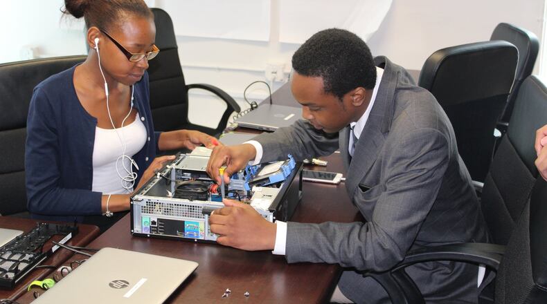 Fredericka Blake and Aaron Williams prep for exams as part of the Year Up program. The nonprofit gives 18- to 24-year-olds a chance to refine their skills and get their studies back on track before taking on a paid internship.