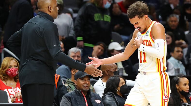 Atlanta Hawks guard Trae Young gets five from head coach Nate McMillan during a 113-101 victory over the Oklahoma City Thunder in a NBA basketball game on Monday, Nov. 22, 2021, in Atlanta. “Curtis Compton / Curtis.Compton@ajc.com”