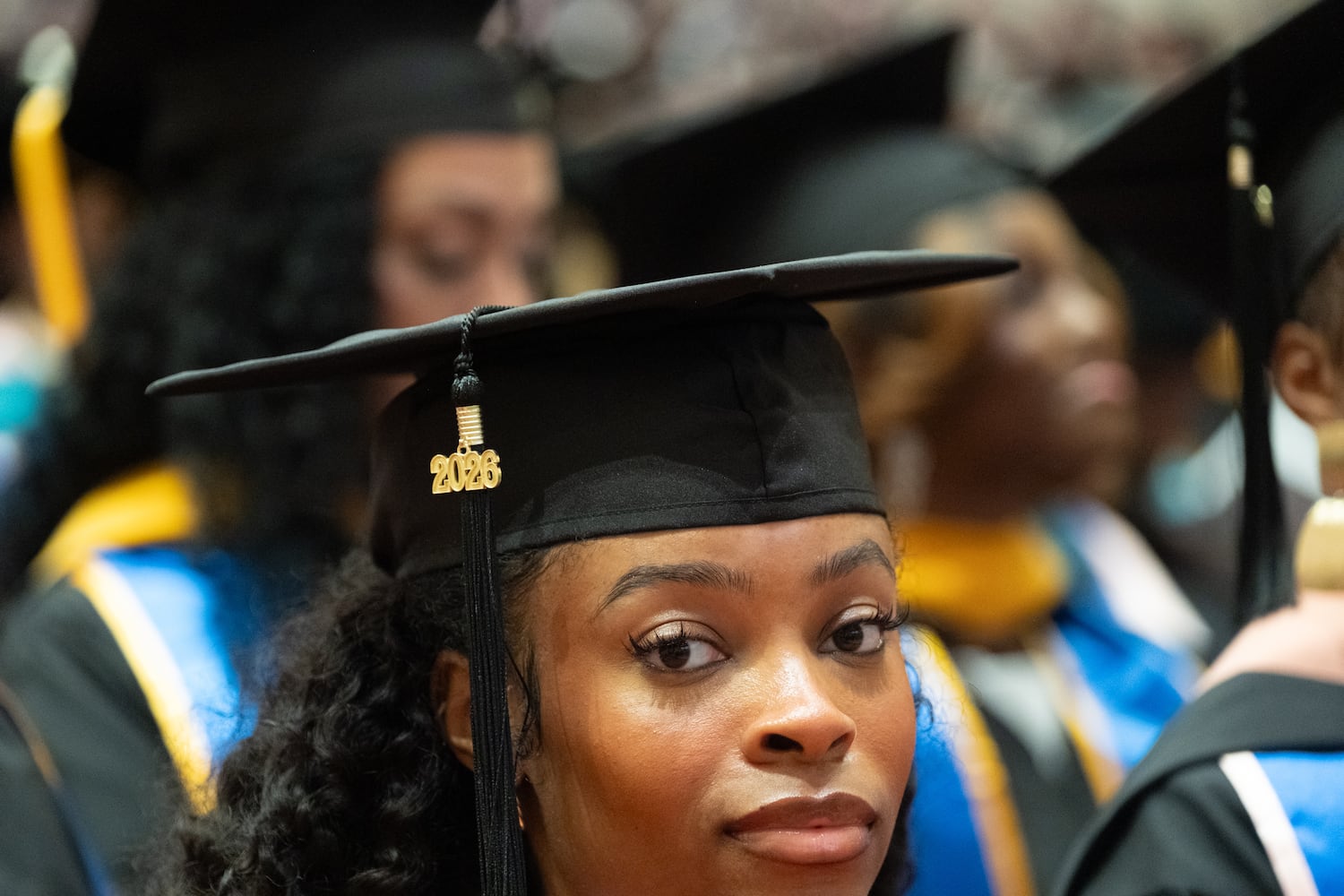 Jennifer Moore, who earned a master’s of public health, sits in the front row during the start of the graduation ceremony for Morehouse School of Medicine students on Saturday, May 16, 2026, in Atlanta. (Ben Gray for the AJC)