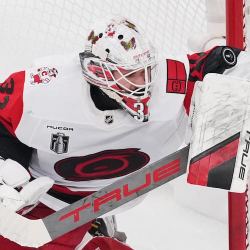 Carolina Hurricanes goaltender Brandon Bussi (32) stops a shot on goal during the first period in Game 6 of the NHL hockey Stanley Cup Final series against the Vegas Golden Knights, Sunday, June 14, 2026, in Las Vegas. (AP Photo/Candice Ward)
