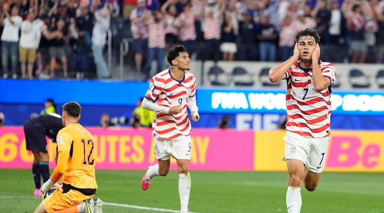 United States' Giovanni Reyna, right, reacts after scoring his team's fourth goal during the World Cup Group D soccer match between the United States and Paraguay in Inglewood, Calif., near Los Angeles, Friday, June 12, 2026. (AP Photo/Mark J. Terrill)