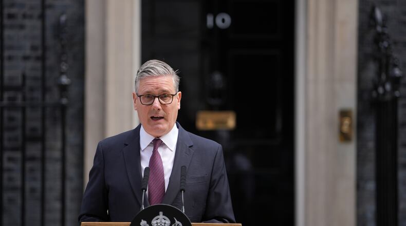 Britain's Prime Minister Keir Starmer announces his resignation to the media outside 10 Downing Street in London, Monday, June 22, 2026. (AP Photo/Kin Cheung)